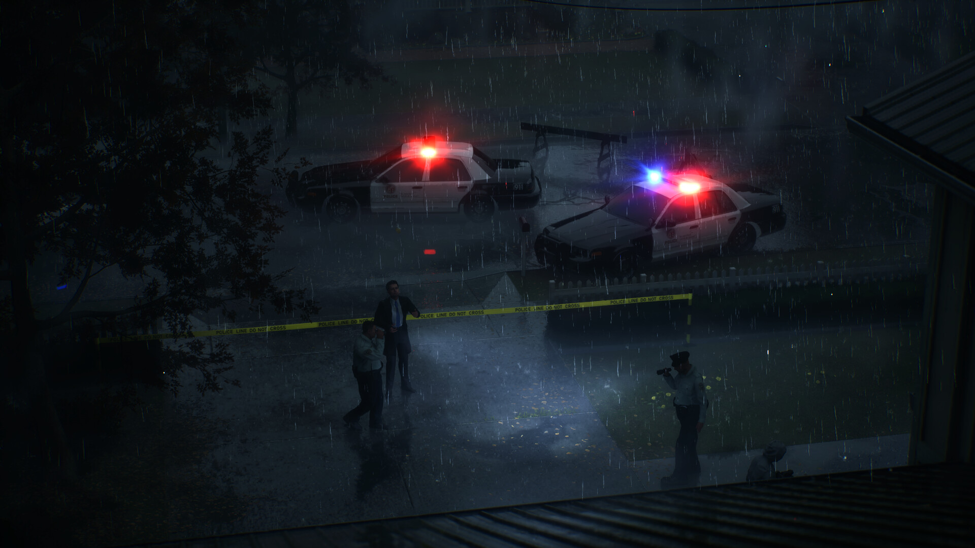 The detective looks back across the active police perimeter before entering the house.