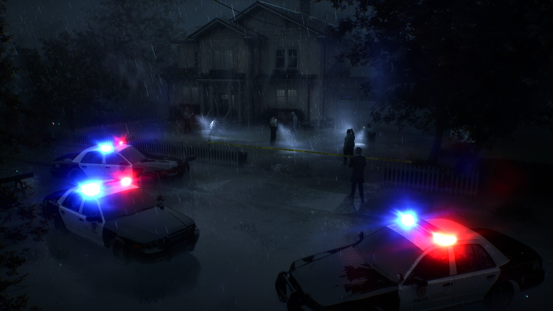 A wide view of the house, police vehicles, and investigators at night.